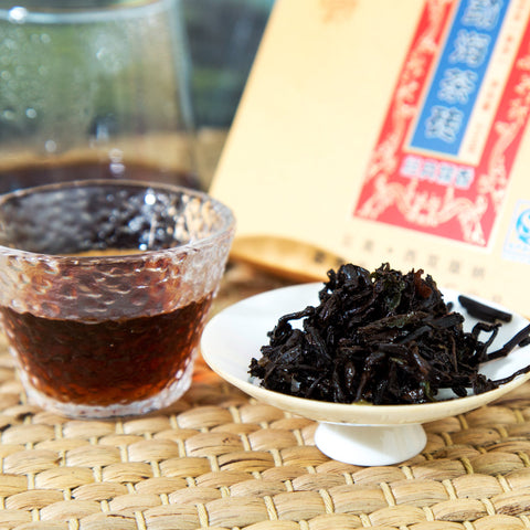 brewed aged pu erh brick tea leaves and tea