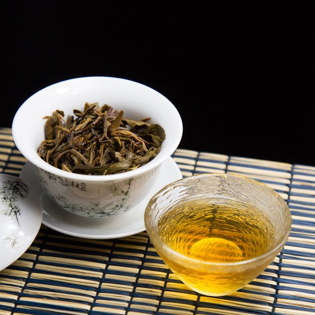 bu lang mountain raw Pu erh tea and brewed tea leaves